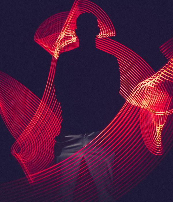 A person in dynamic motion against a minimalist background, conveying energy and focus.