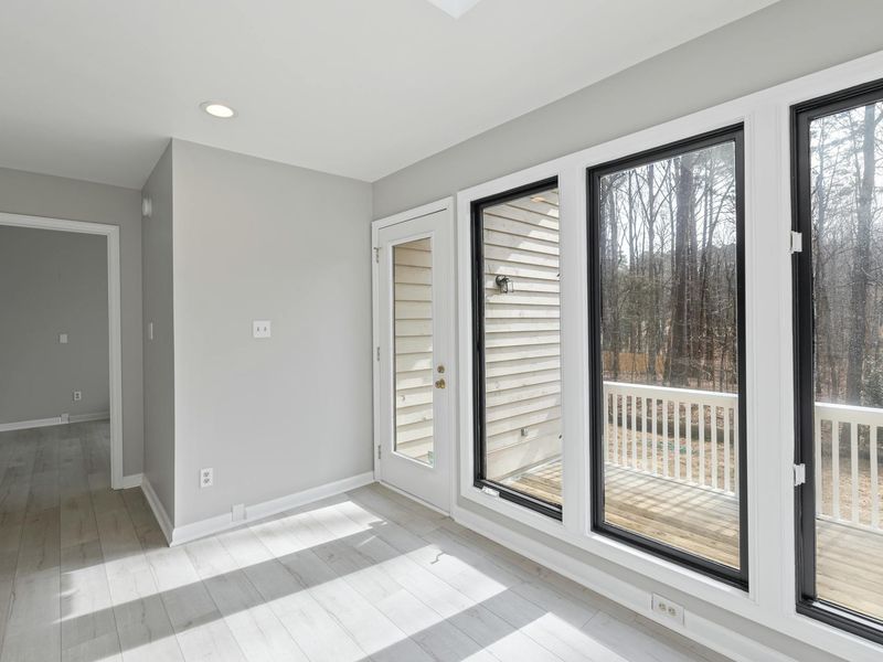 A spacious, well-lit room suitable for home workouts, clean and minimalist.