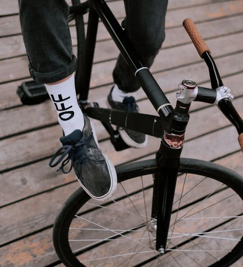 Close-up shot of a person's feet in athletic shoes, emphasizing stability and form.